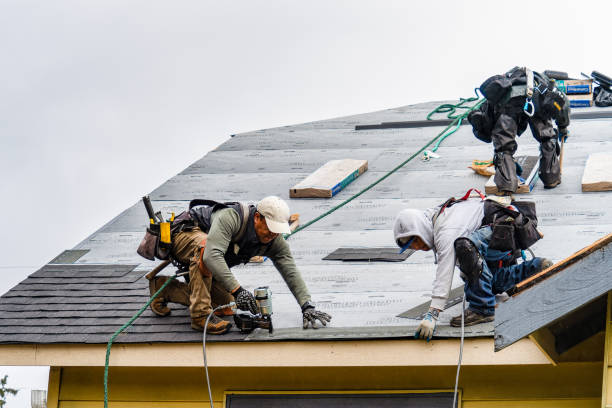 Professional Roofing technician working in North Babylon, NY